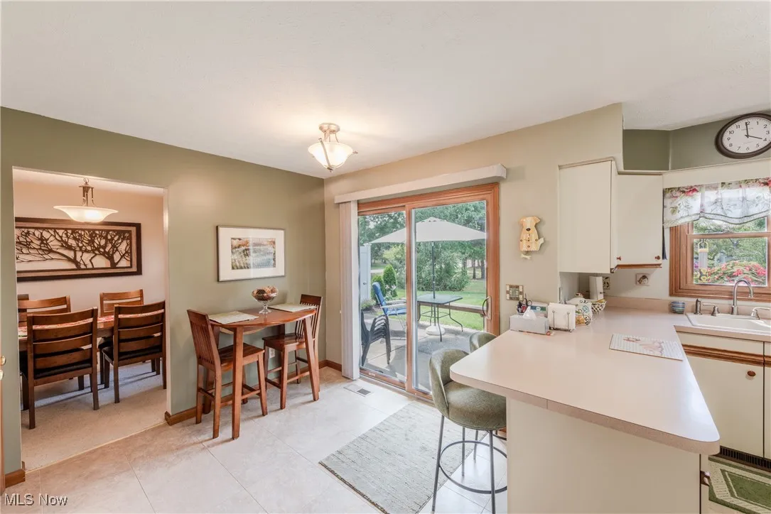 Kitchen area with glass patio doors leading to the back porch