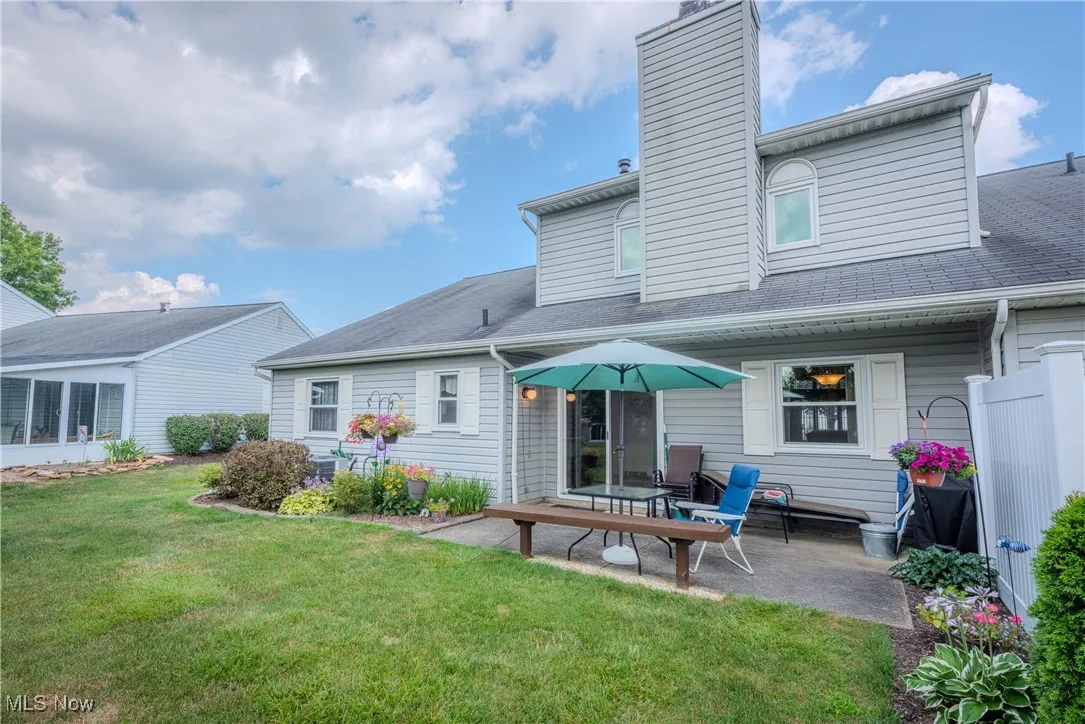 Rear view of house featuring a patio