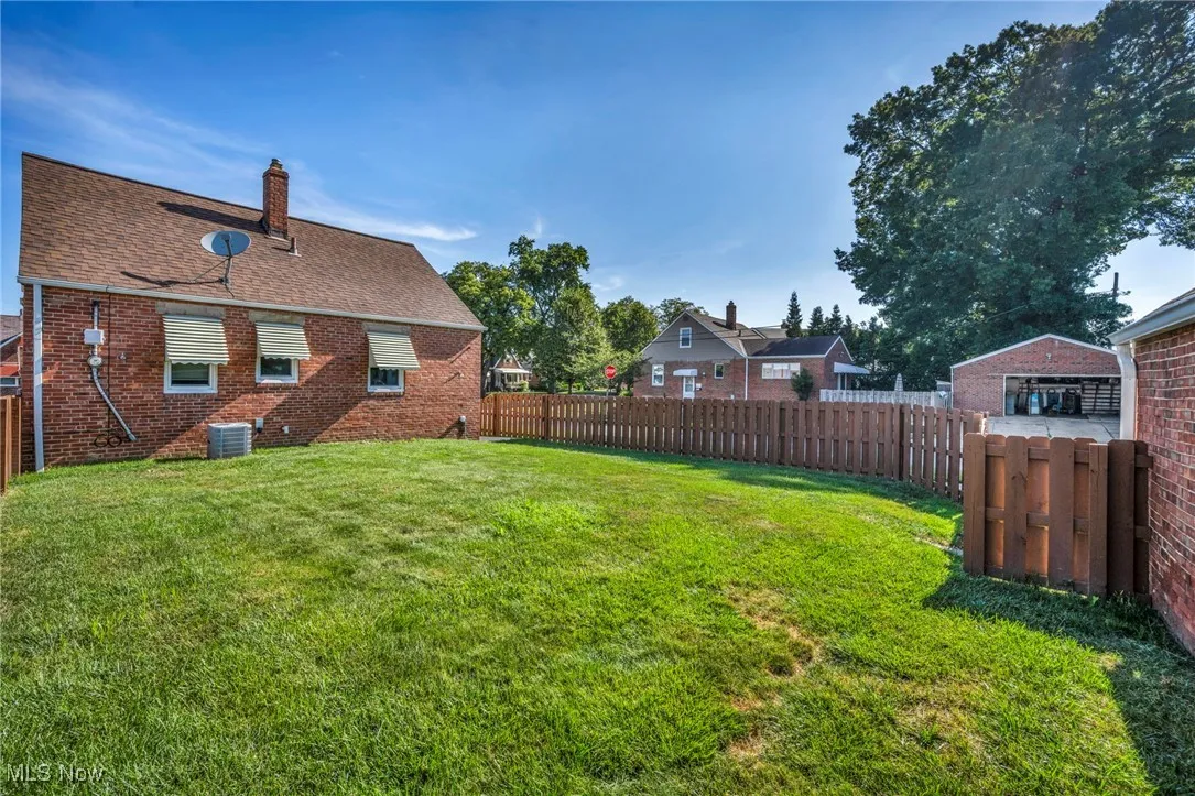 View of fenced backyard