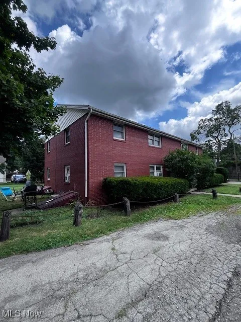 View of side of home with brick siding