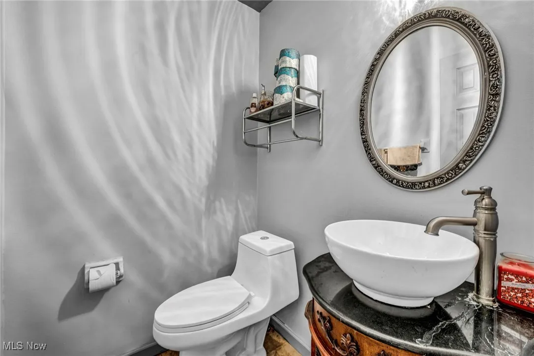 Half bath with vanity and toilet