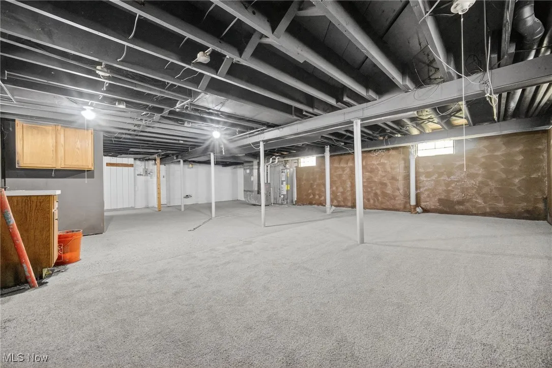 Basement with heating unit and electric water heater