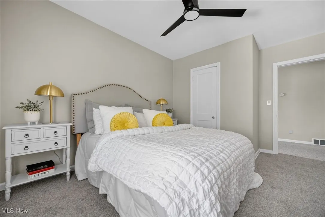 Bedroom with carpet flooring and ceiling fan