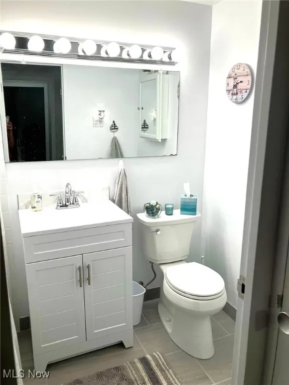 Bathroom featuring vanity and tile patterned floors