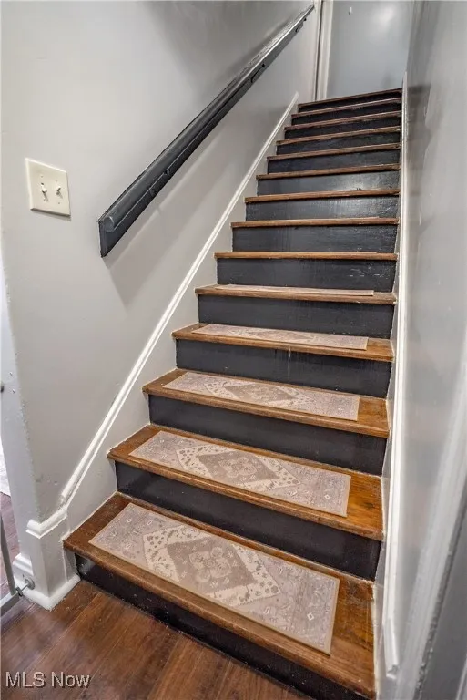 Entry with hardwood stairs