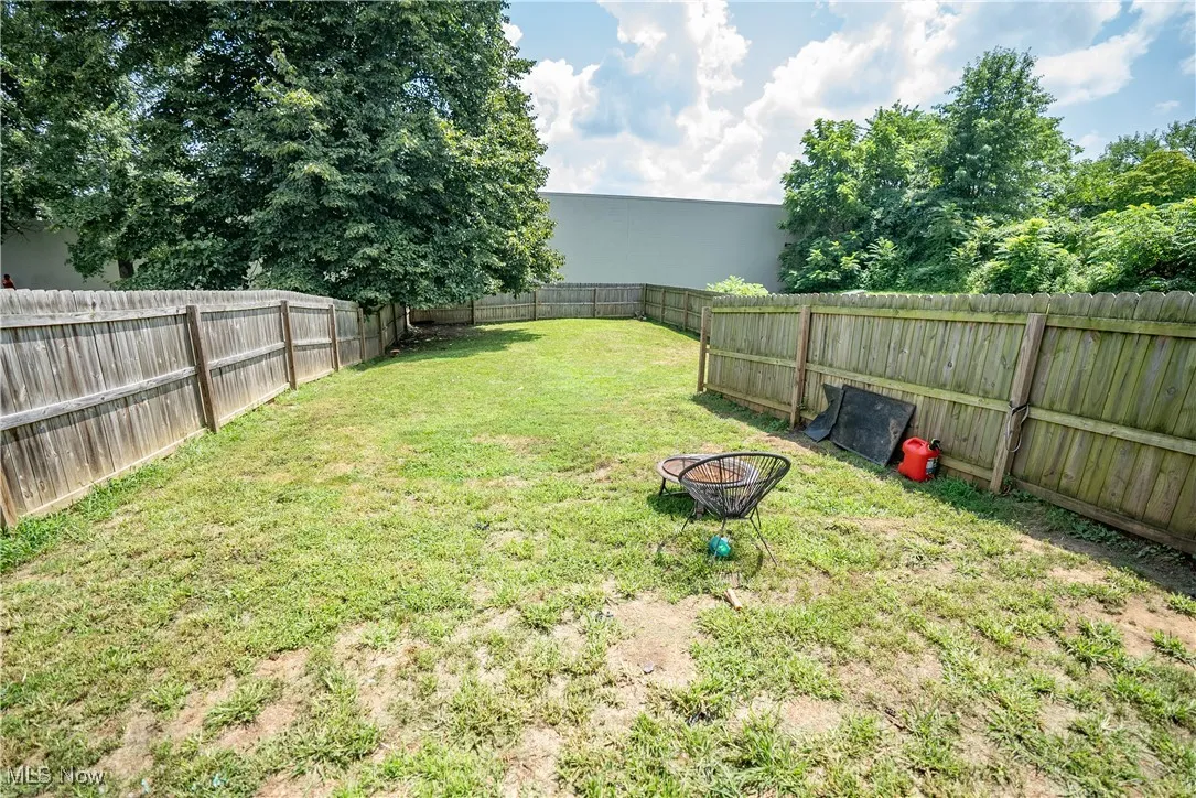 Privacy fence surrounds backyard