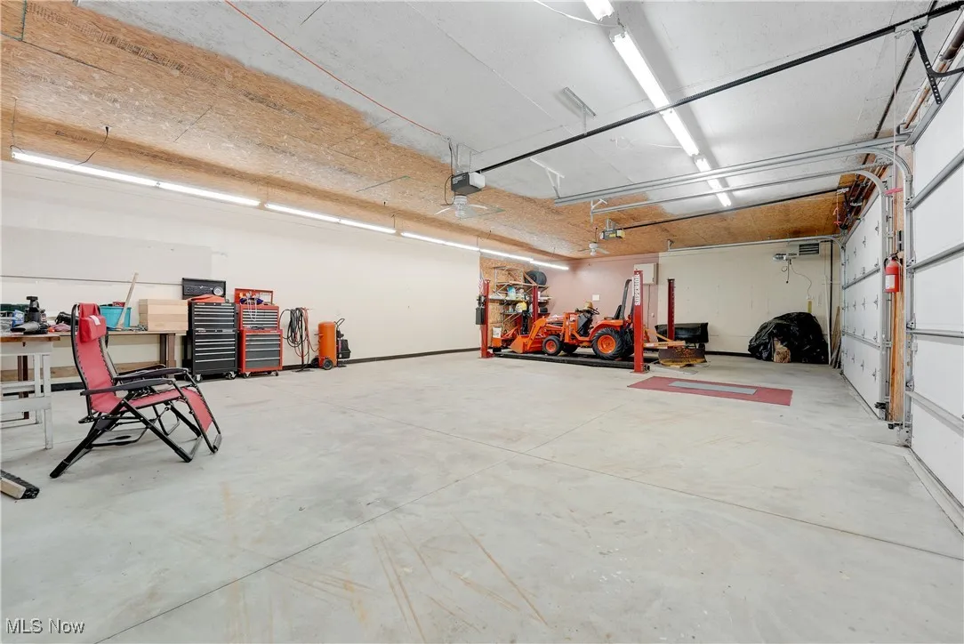 First Floor Outbuilding with 4- post car lift.