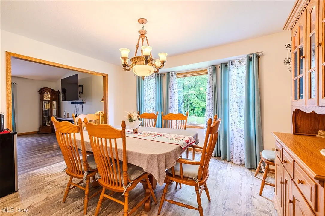 Dining room featuring a chandelier and light wood finished floors