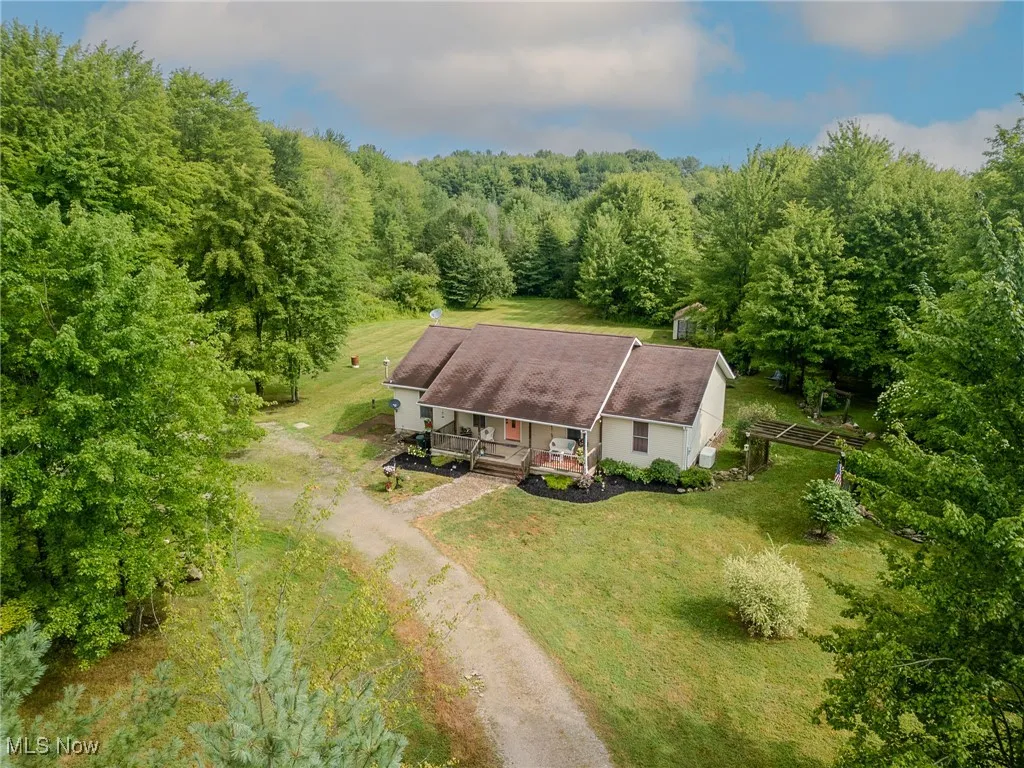 View from above of property with a forest