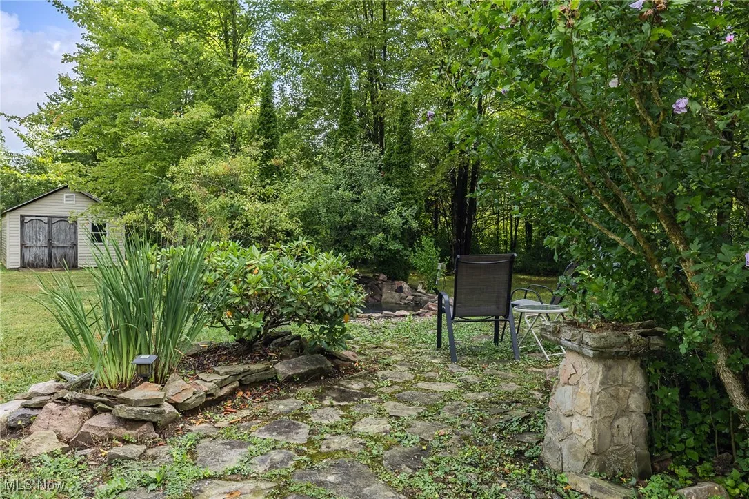 View of yard with a shed