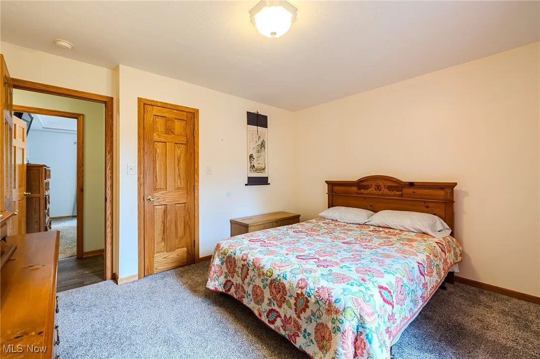 Bedroom featuring baseboards and carpet flooring
