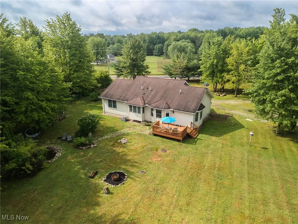 View from above of property featuring a heavily wooded area