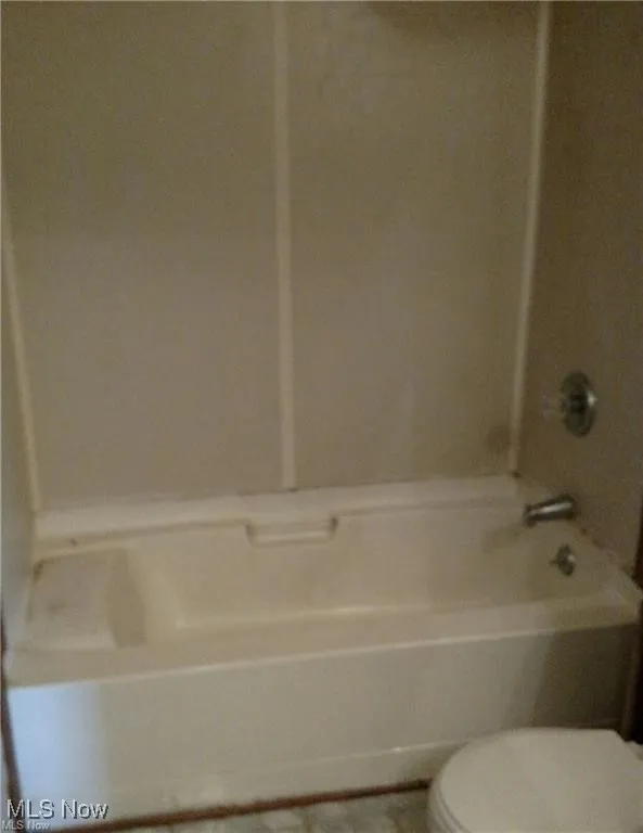 Full bathroom featuring toilet and bathtub / shower combination
