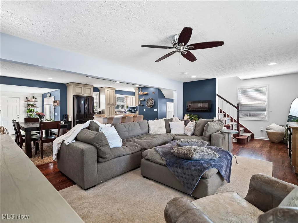Large family room with loads of light and hardwood floors