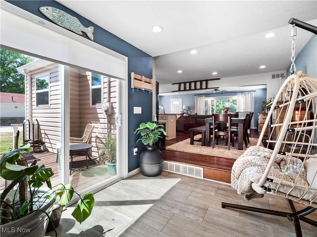 Sun Room off the garage currently used as a sunroom, but could also be large mudroom