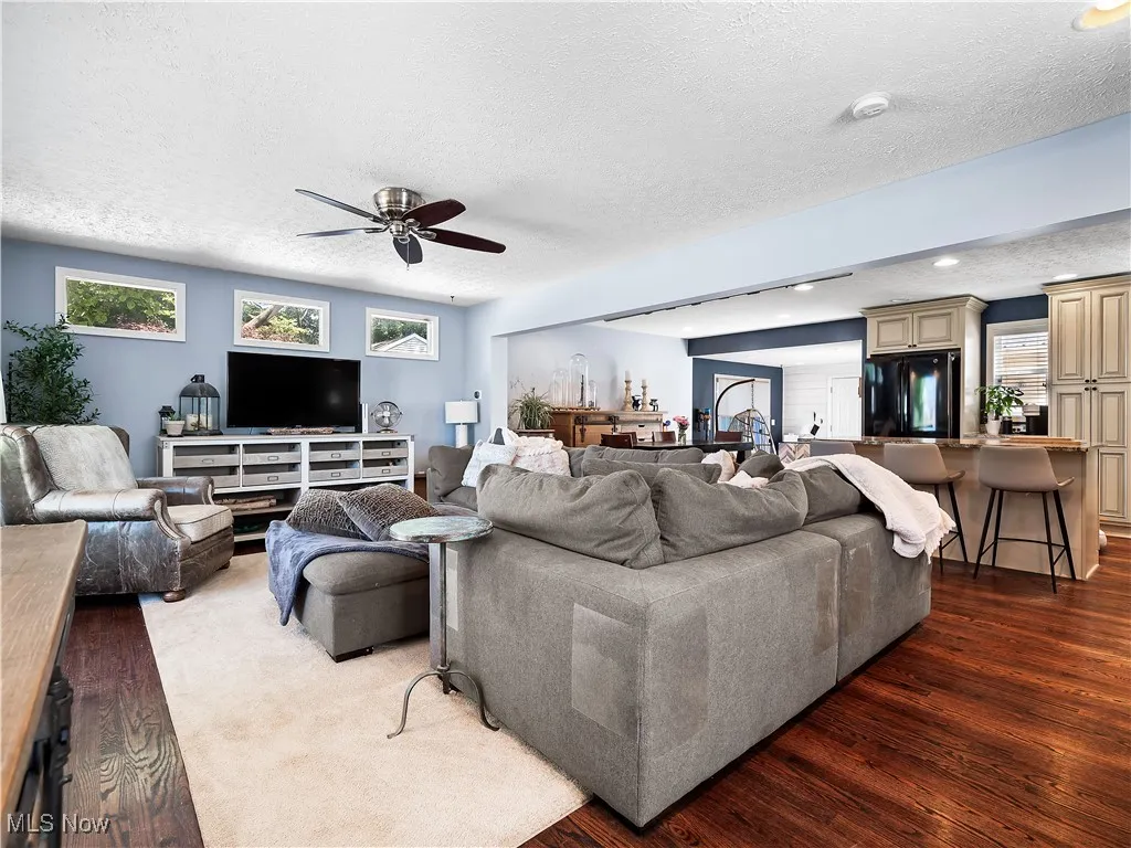 Large family room with loads of light and hardwood floors