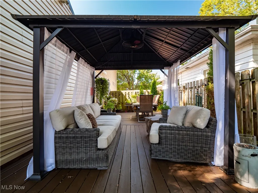 Colonial house with a metal roof, large front yard, and attached garage