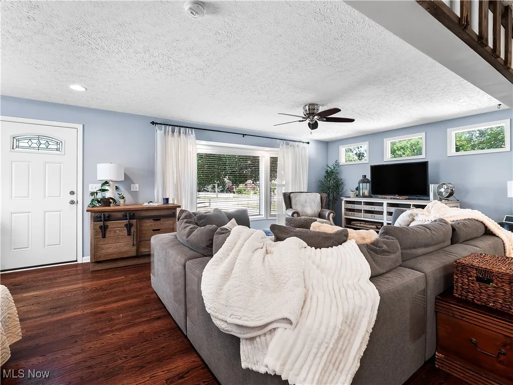 Large family room with loads of light and hardwood floors