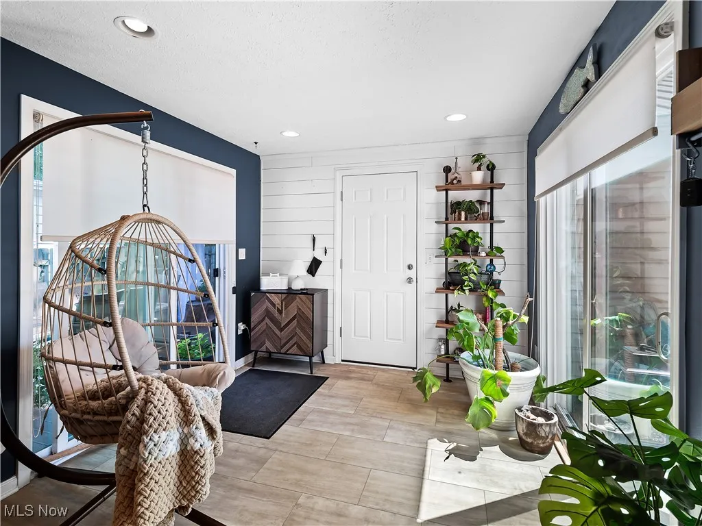 Sun Room off the garage currently used as a sunroom, but could also be large mudroom
