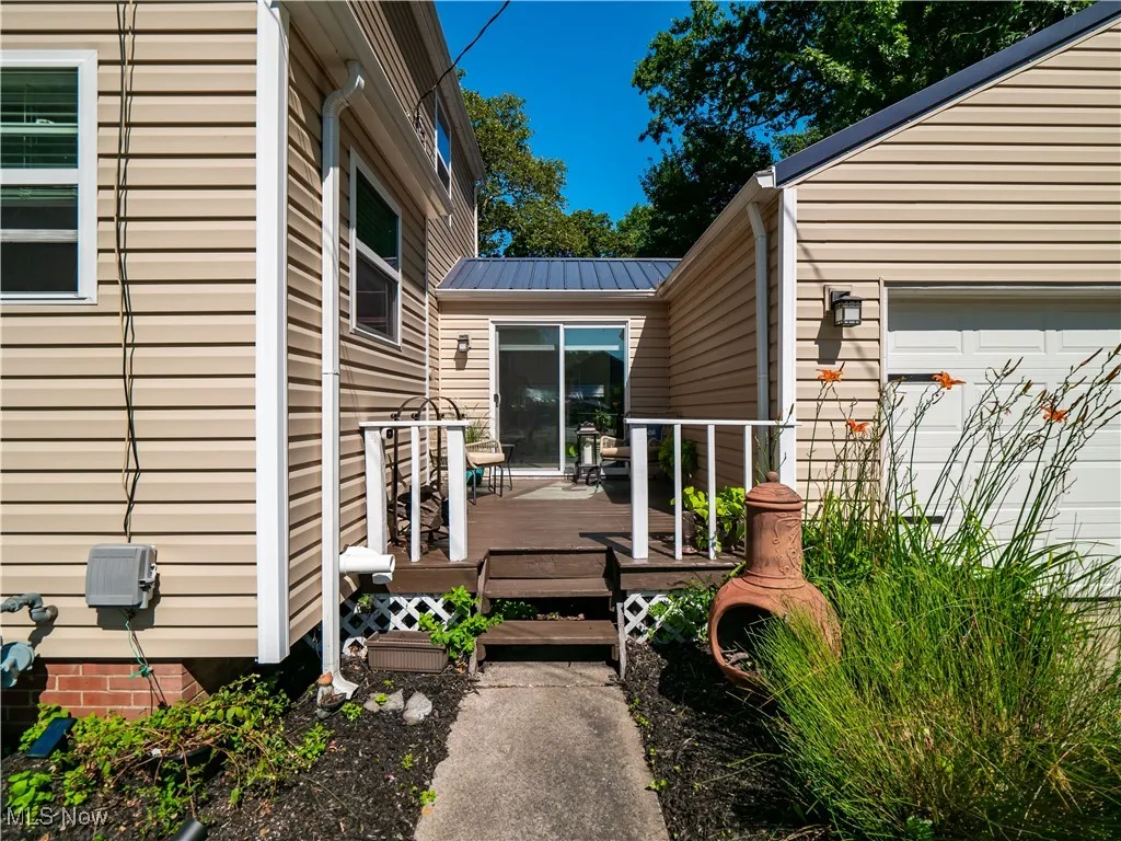 Side wood deck with an attached garage