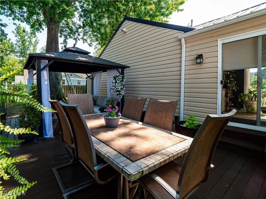 Wooden terrace featuring a gazebo