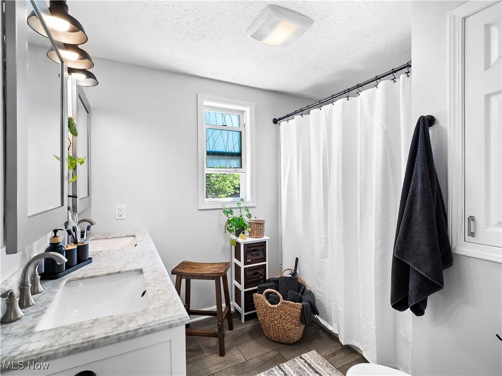 Bathroom Full bath with double vanity and tub/shower combo