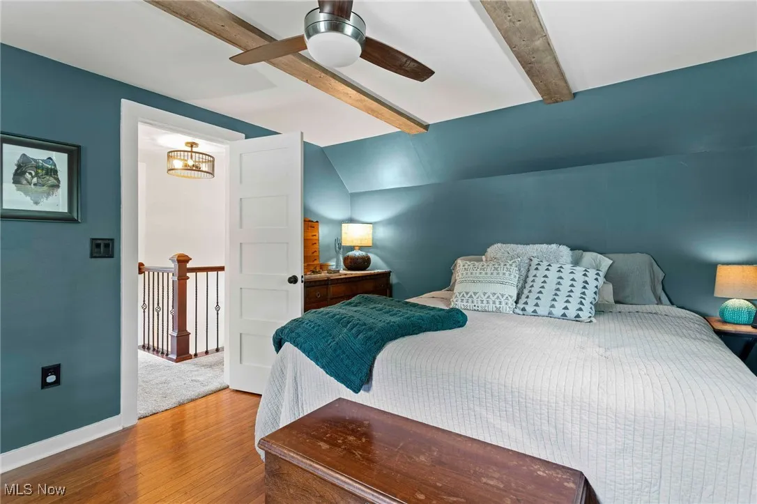 Bedroom with wood finished floors and ceiling fan