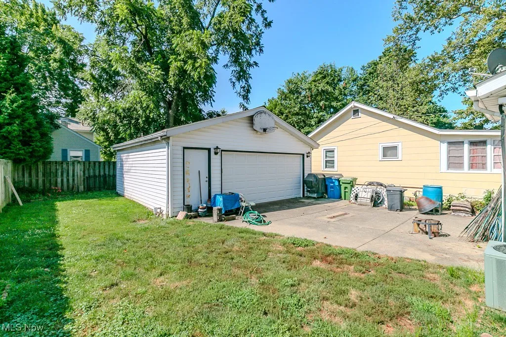 Rear view of house with a garage