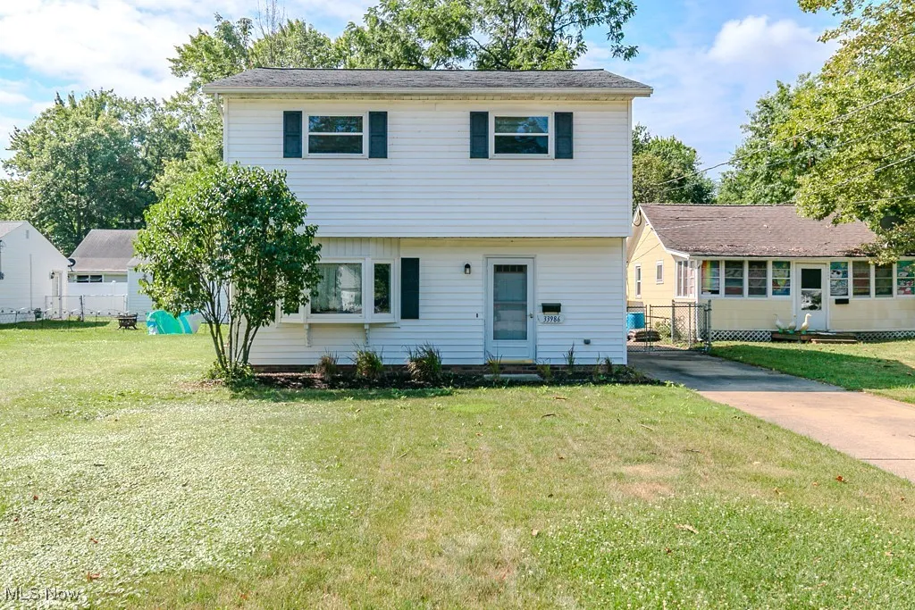 Colonial-style house with driveway