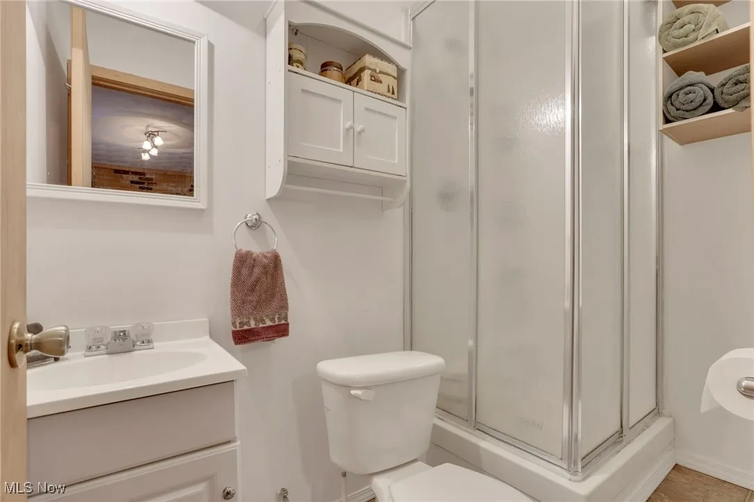Bathroom with vanity and a shower stall