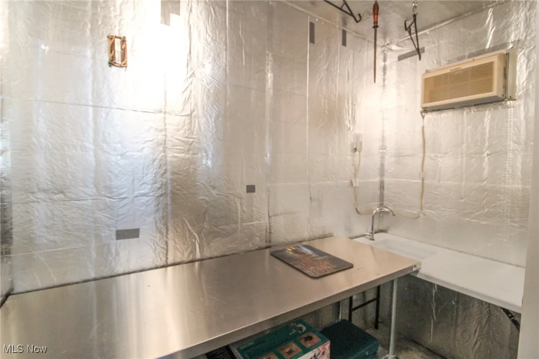 Bathroom featuring a wall mounted AC