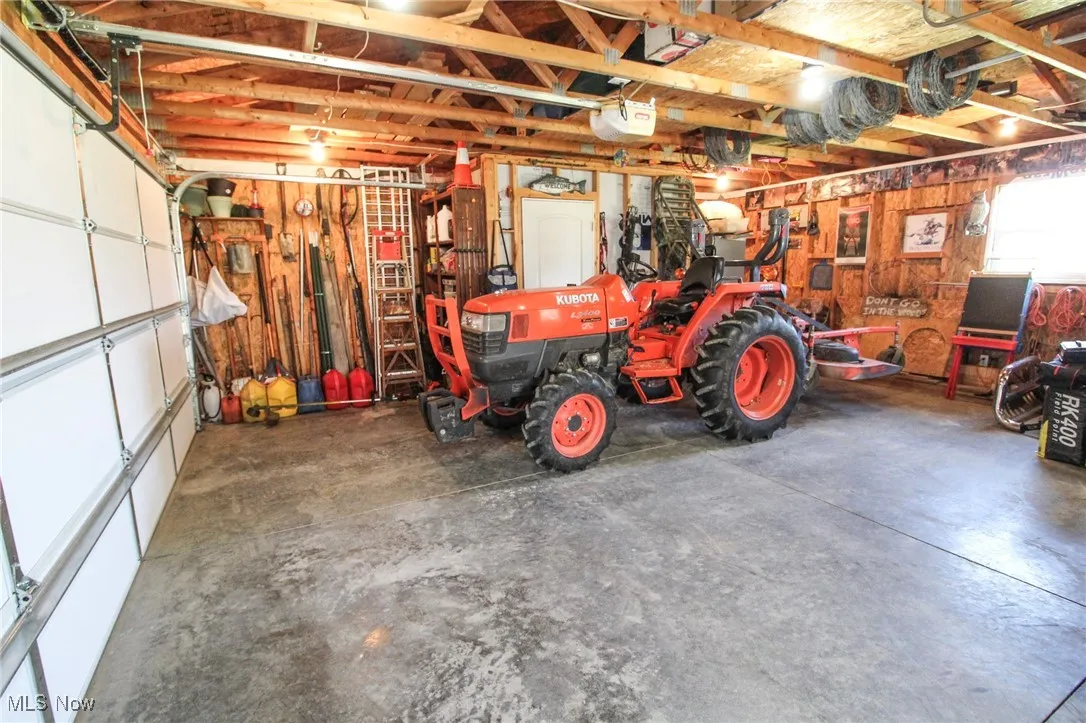 Garage featuring a garage door opener
