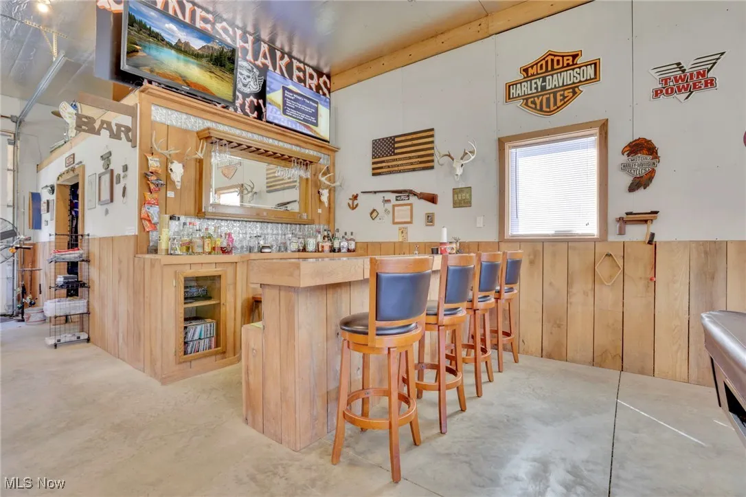 Indoor bar with wooden walls and wainscoting