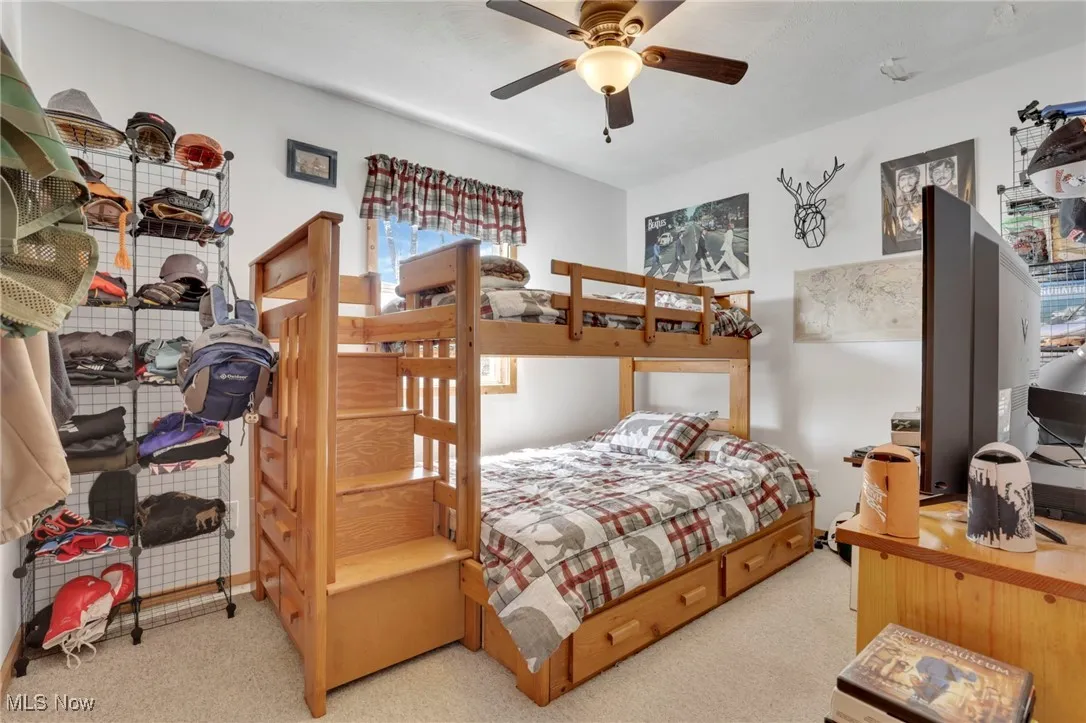 Bedroom featuring carpet flooring and a ceiling fan