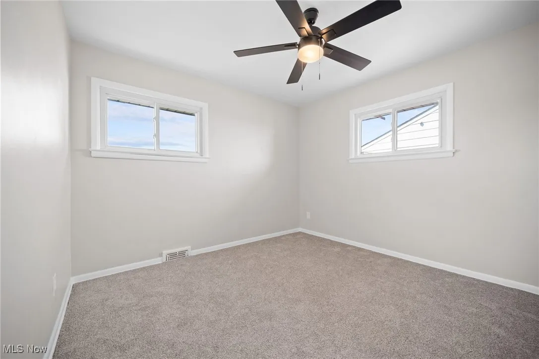 Bedroom featuring carpet floors, plenty of natural light, and ceiling fan