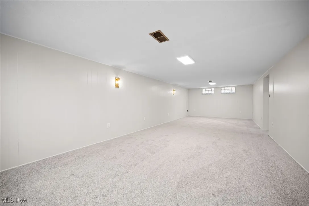 Basement featuring carpet flooring