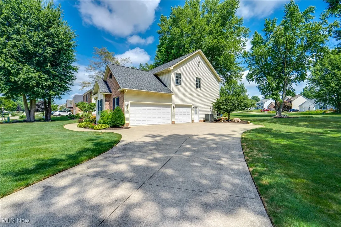 driveway leading to a 3 car attached garage