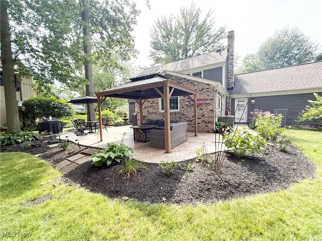 View of patio / terrace with a gazebo and an outdoor hangout area