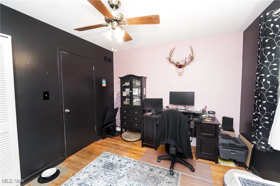 Office featuring ceiling fan and light wood-style floors