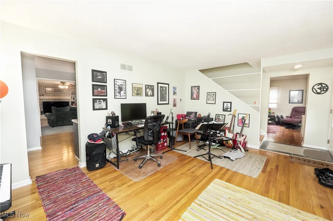 Office space with wood finished floors and baseboards
