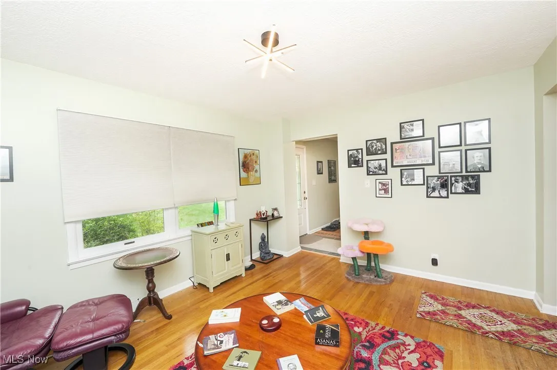 Living room with light wood-style flooring