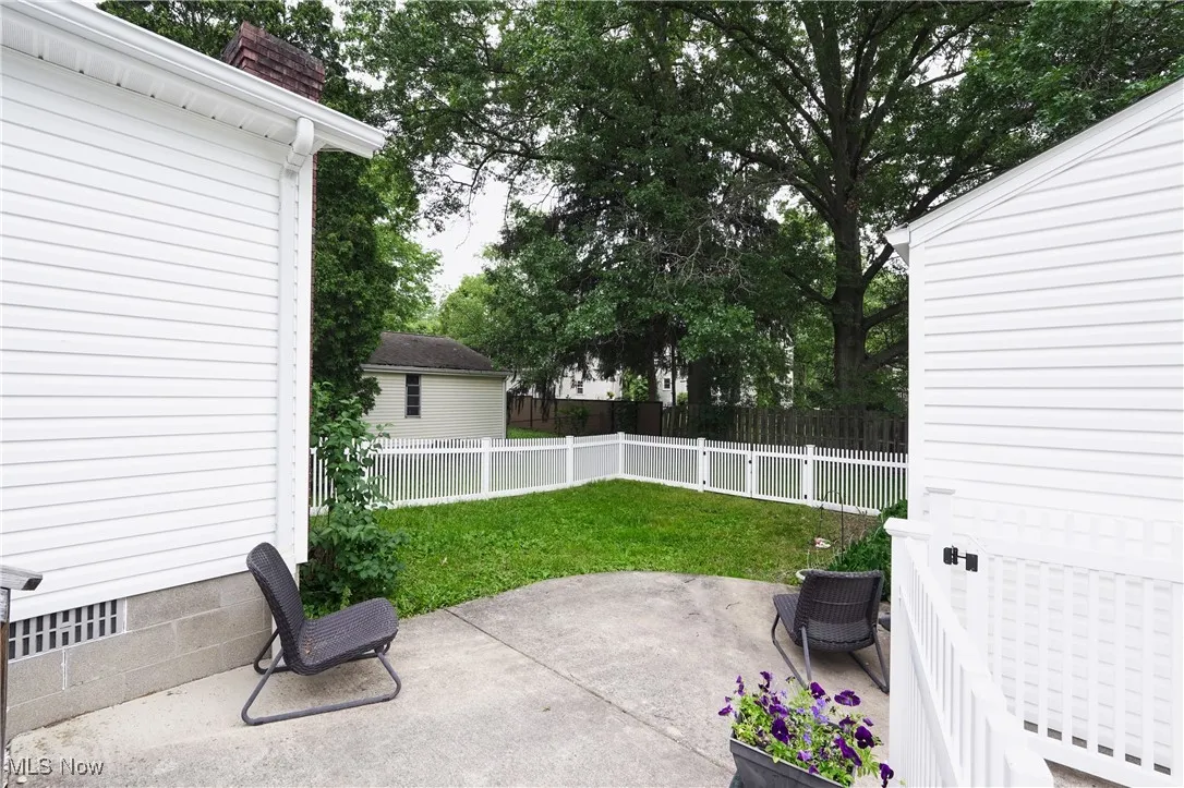 Fenced backyard with a patio area