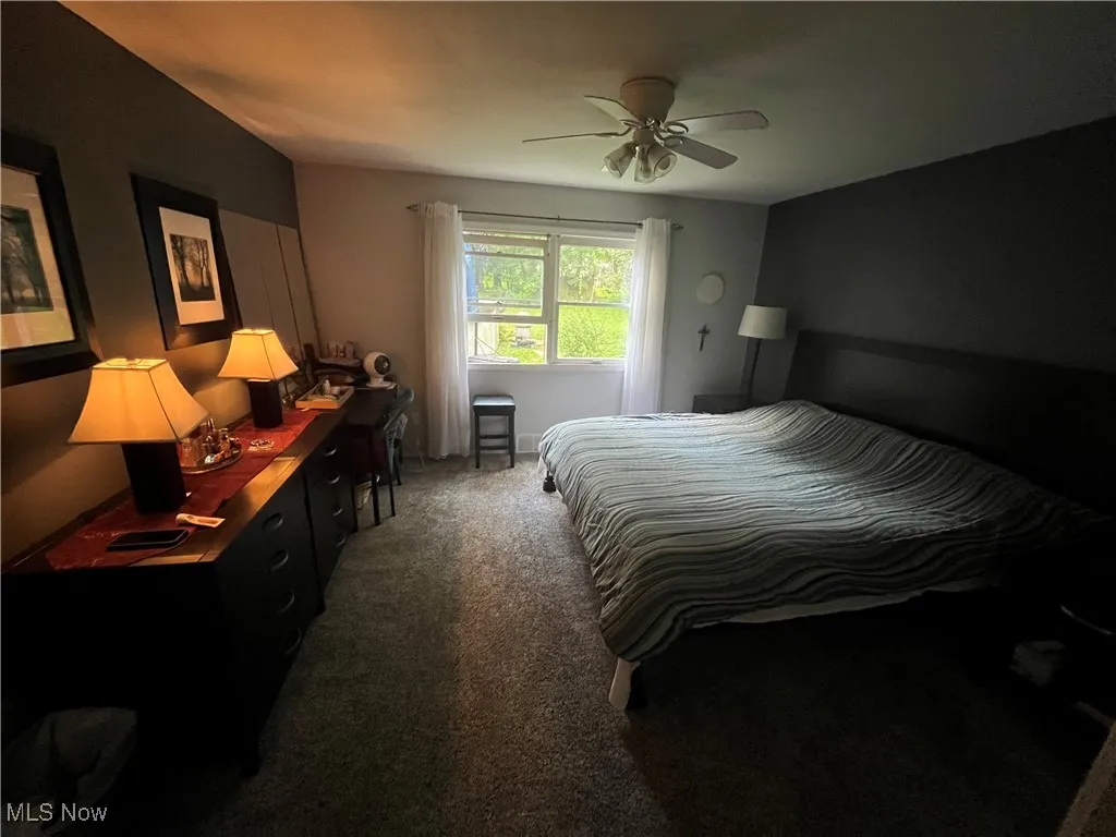 Bedroom featuring carpet floors and a ceiling fan