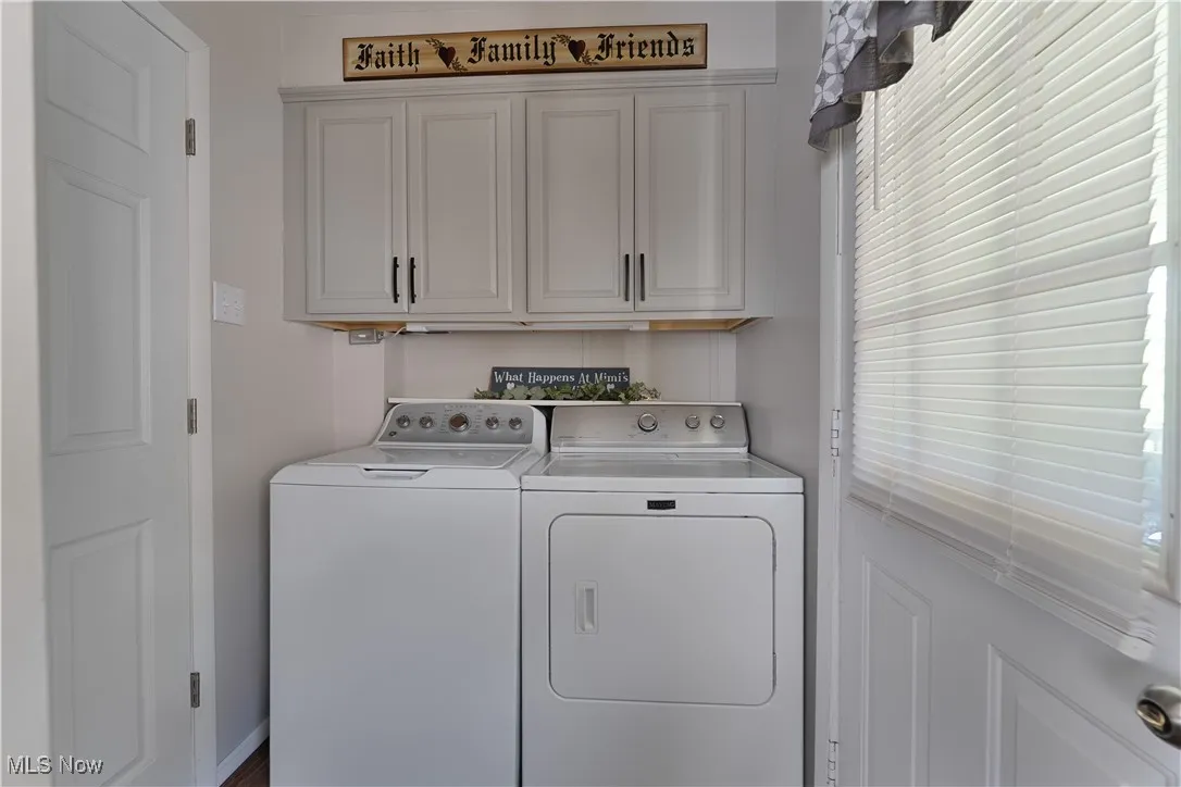 Laundry room with cabinet space and separate washer and dryer