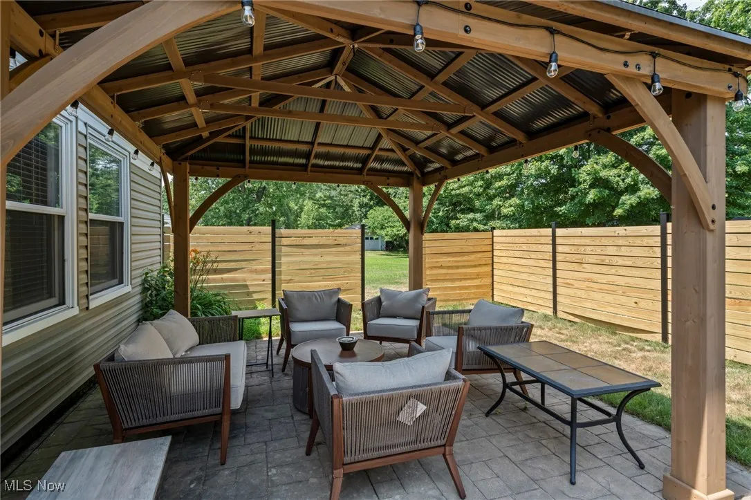 View of patio / terrace featuring an outdoor hangout area and a gazebo