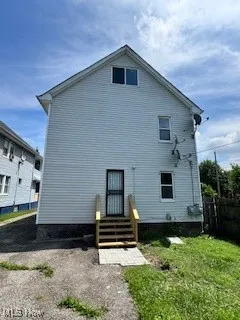 Rear view of property with entry steps