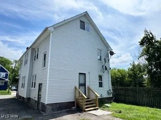Back of property with entry steps