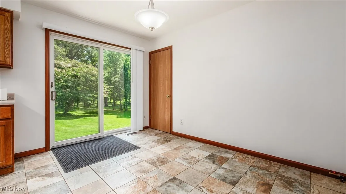 Entryway featuring baseboards
