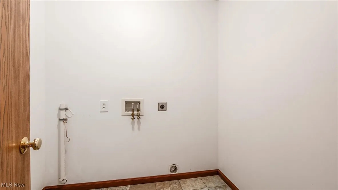 Washroom with hookup for an electric dryer and washer hookup