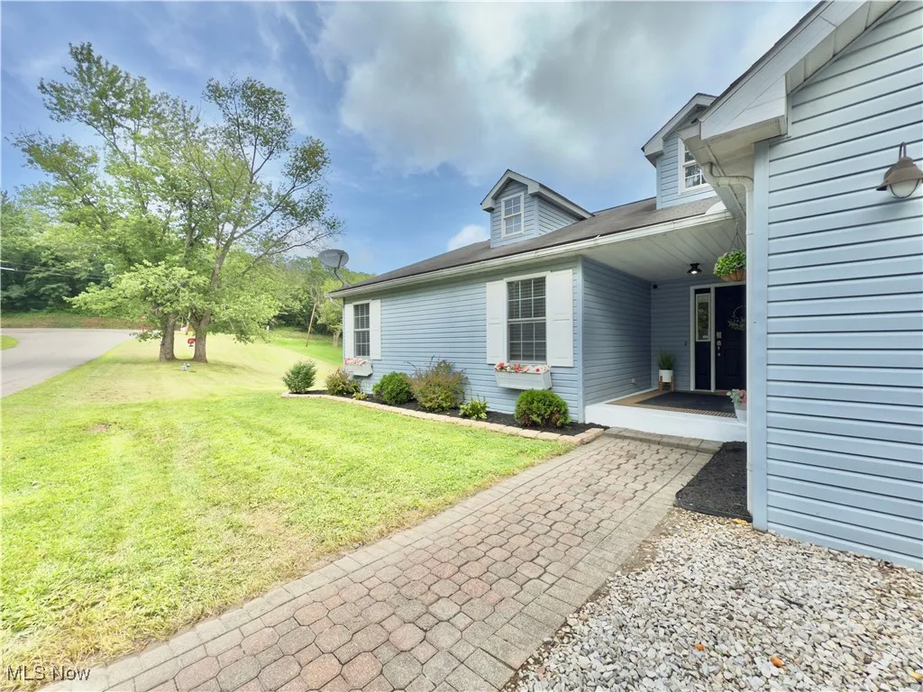 View of home's exterior featuring a lawn